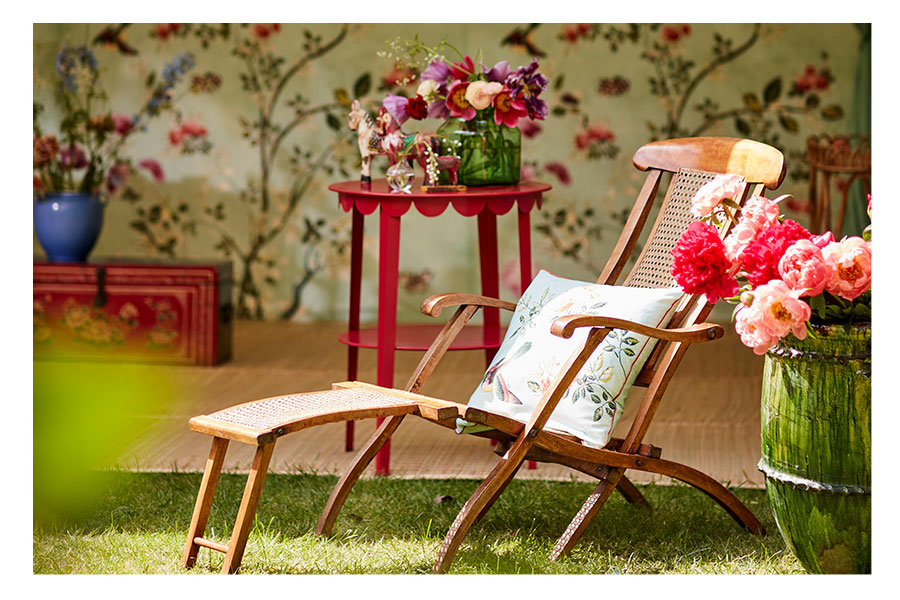 Raj-Tent-Club-and-the-VA-Outdoor-living-Chinoiserie-Raj-tent-Chinoiserie-cushion-on-campaign-chair-lifestyle