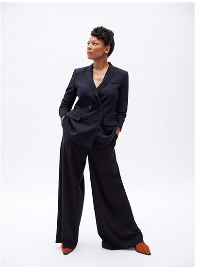 Nina wears jacket and trousers by The Fold; and shoes by Bimba y Lola