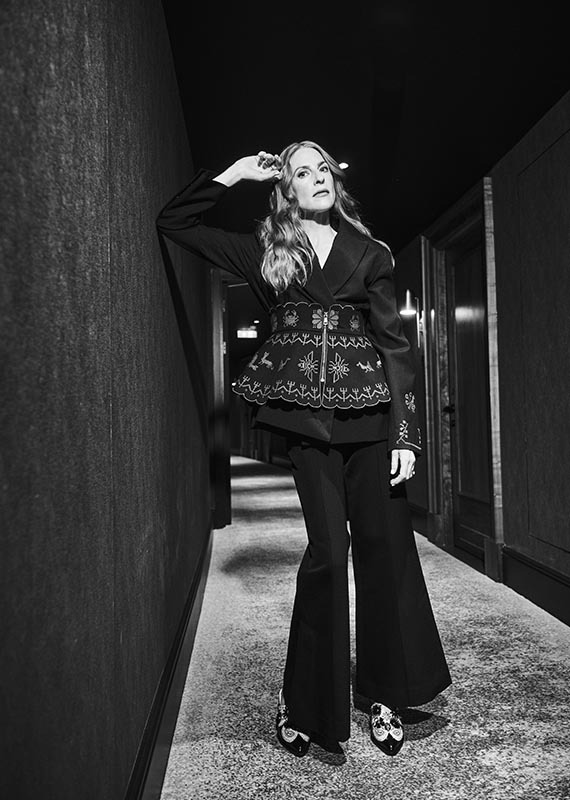 Rosalie wears: suit by Clea; and shoes by Kurt Geiger