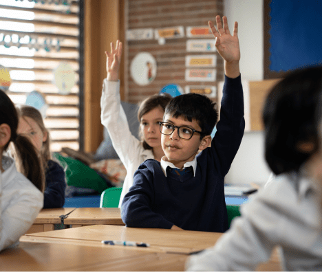 Highgate School boy raising hand in classroom